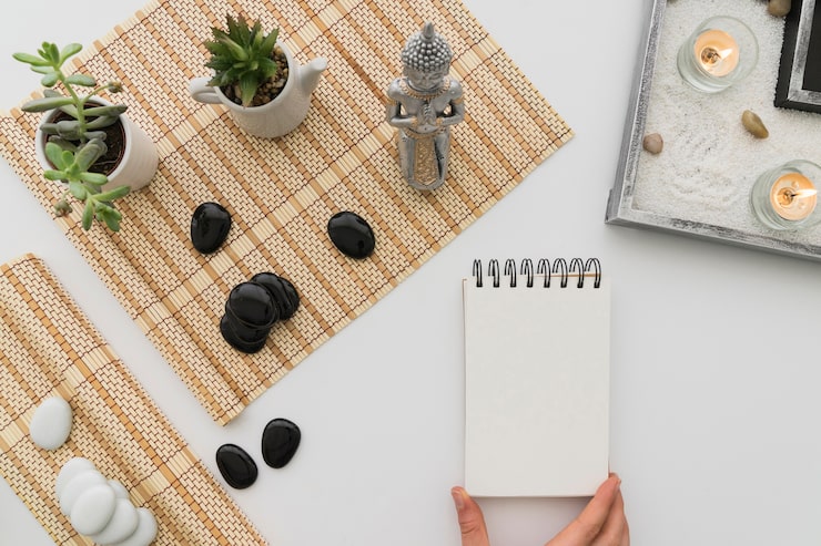 A close-up of a journal and pen, symbolizing the creative output of the meditation practice.